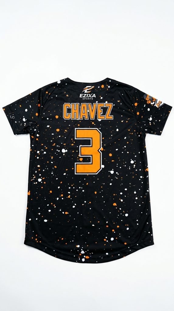 Back view of a black baseball jersey covered in white and orange paint specks featuring player name Chavez and number 3.