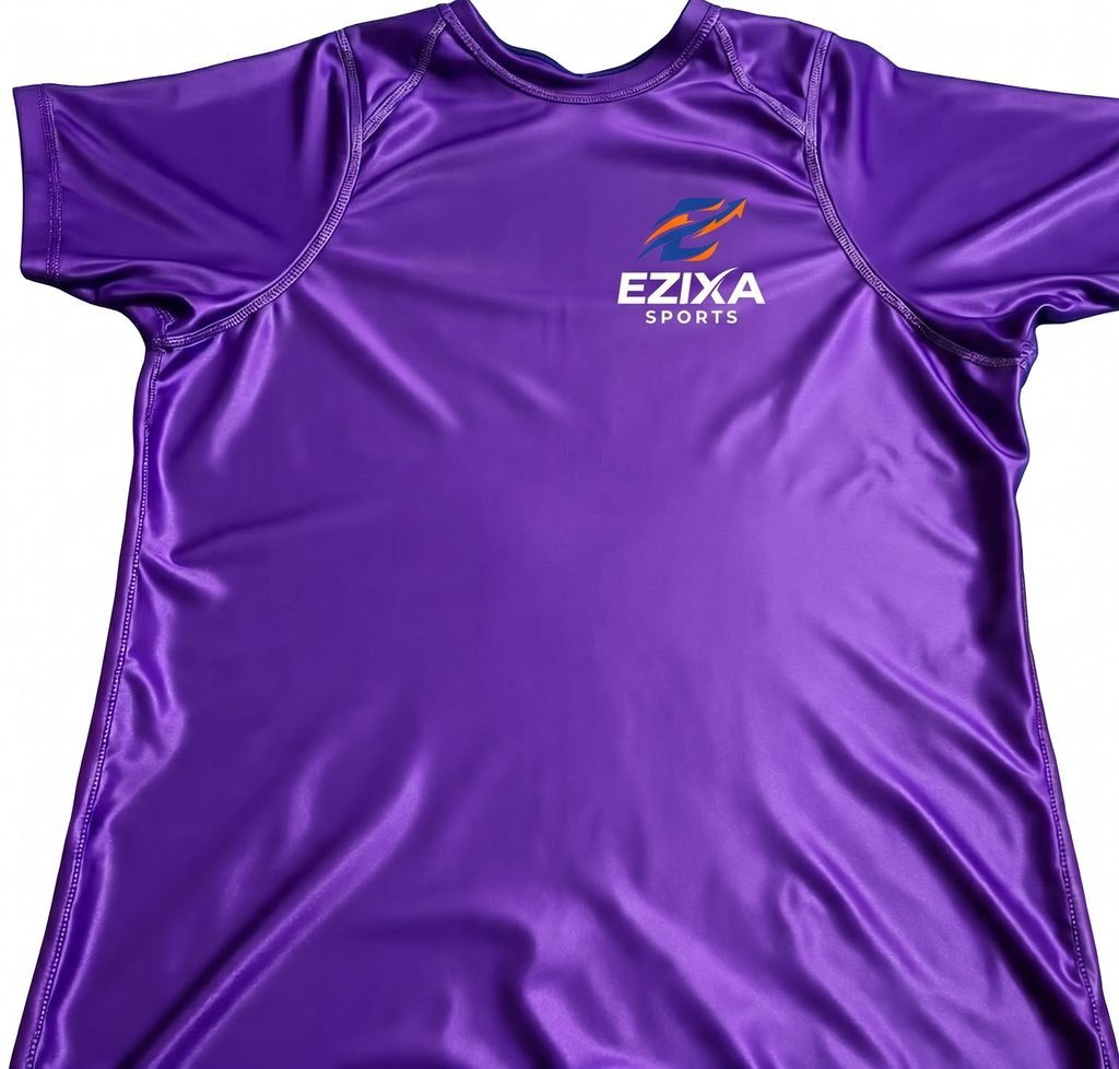 Flat lay top-down view of smooth purple short sleeve EZIXA Sports compression training shirt.